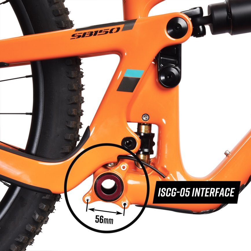 Close-up of the Funn Zippa LG Chain Guide on an orange bike frame, focusing on the CNC-machined alloy ISCG-05 interface with a black circle and text showing the 56mm bolt hole spacing.