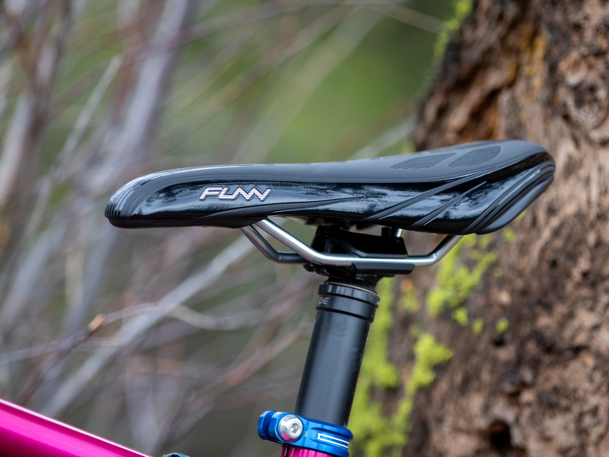 a close-up of a black Funn adlib hd saddle mounted on a bike seatpost.