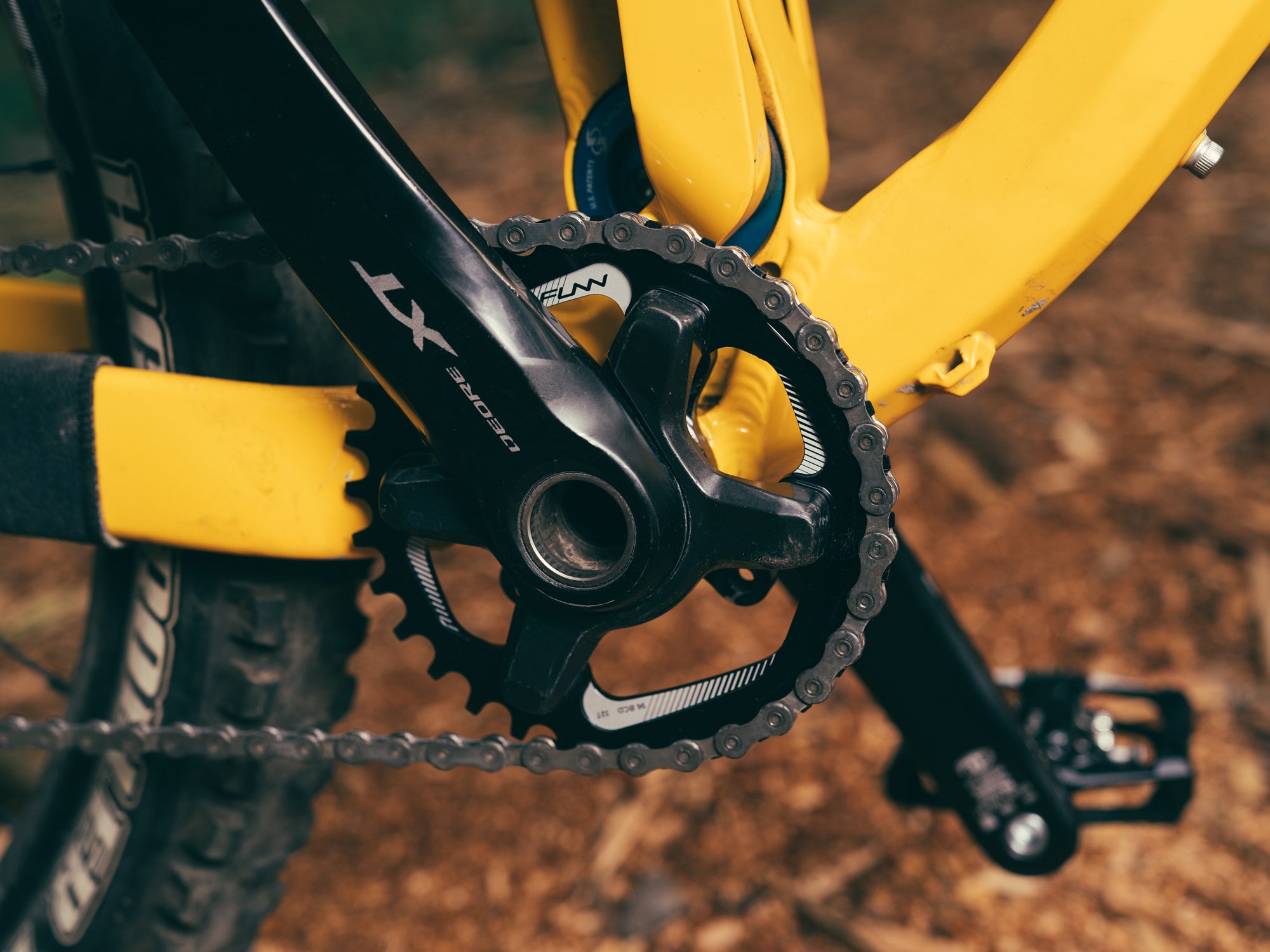 This image shows a close-up of a mountain bike drivetrain, specifically featuring a Funn solo 96 bcd chainring paired with a Shimano XT crankset.