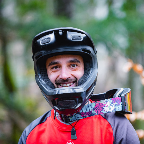 FUNN rider Olivier Cuvet wearing full-face black MTB helmet and red jersey.