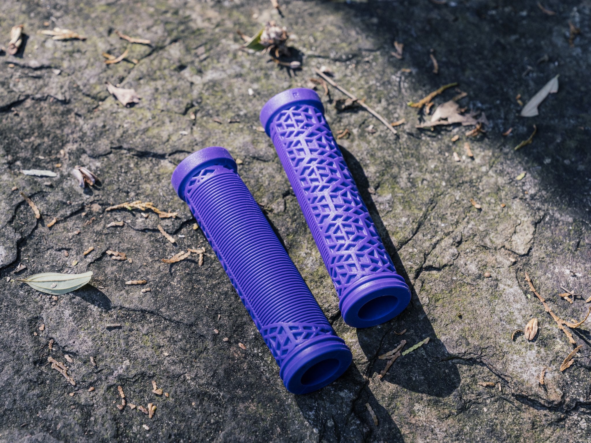 a purple funn hilt es bike grips on the ground