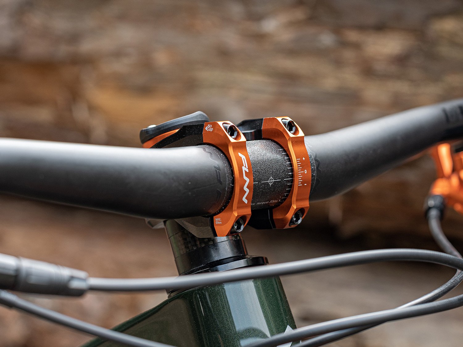 a mountain bike equipped with funn equalizer drop stem in orange color