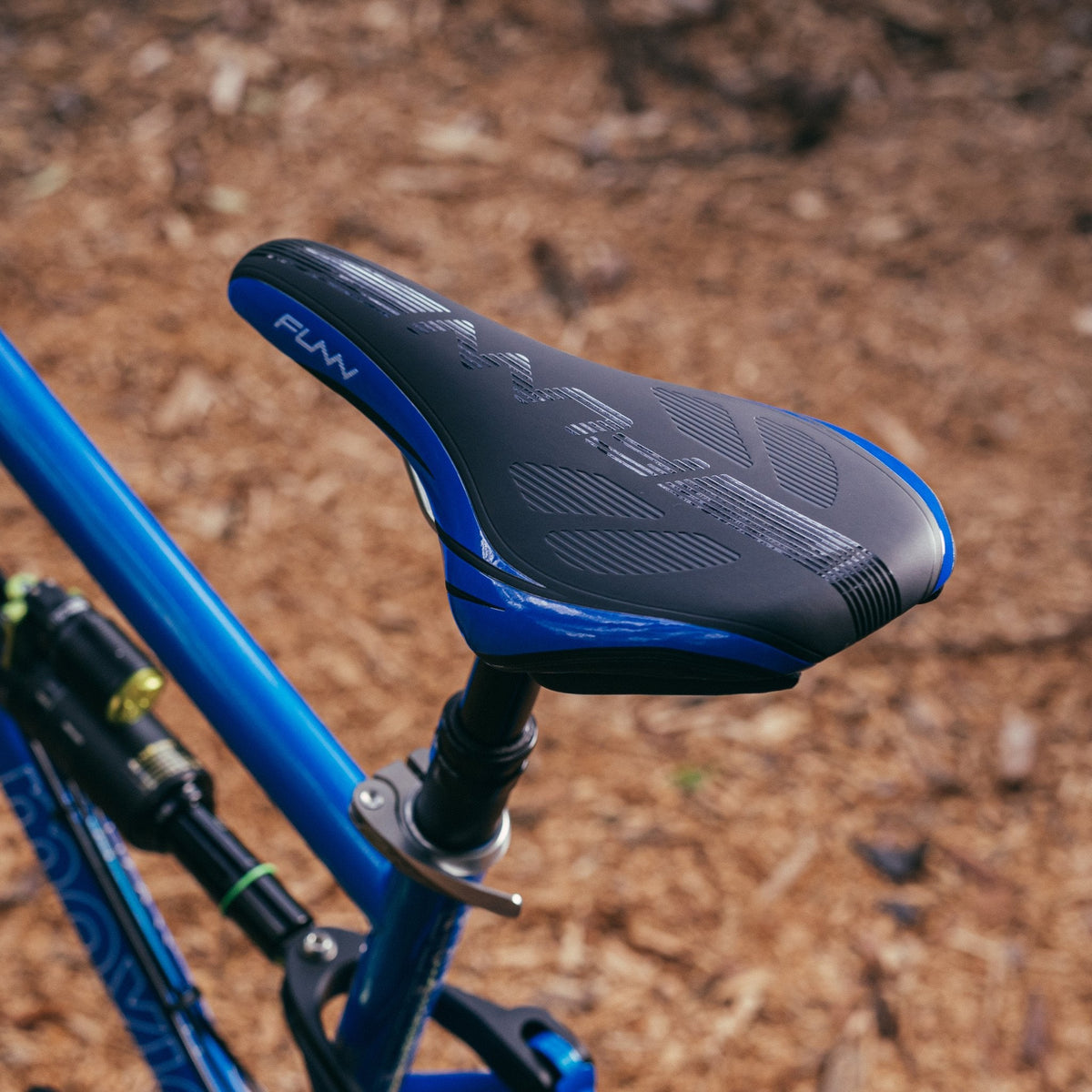 FUNN Adlib HD Saddle in black and blue on mountain bike, ergonomic padded seat for trail riding comfort and control