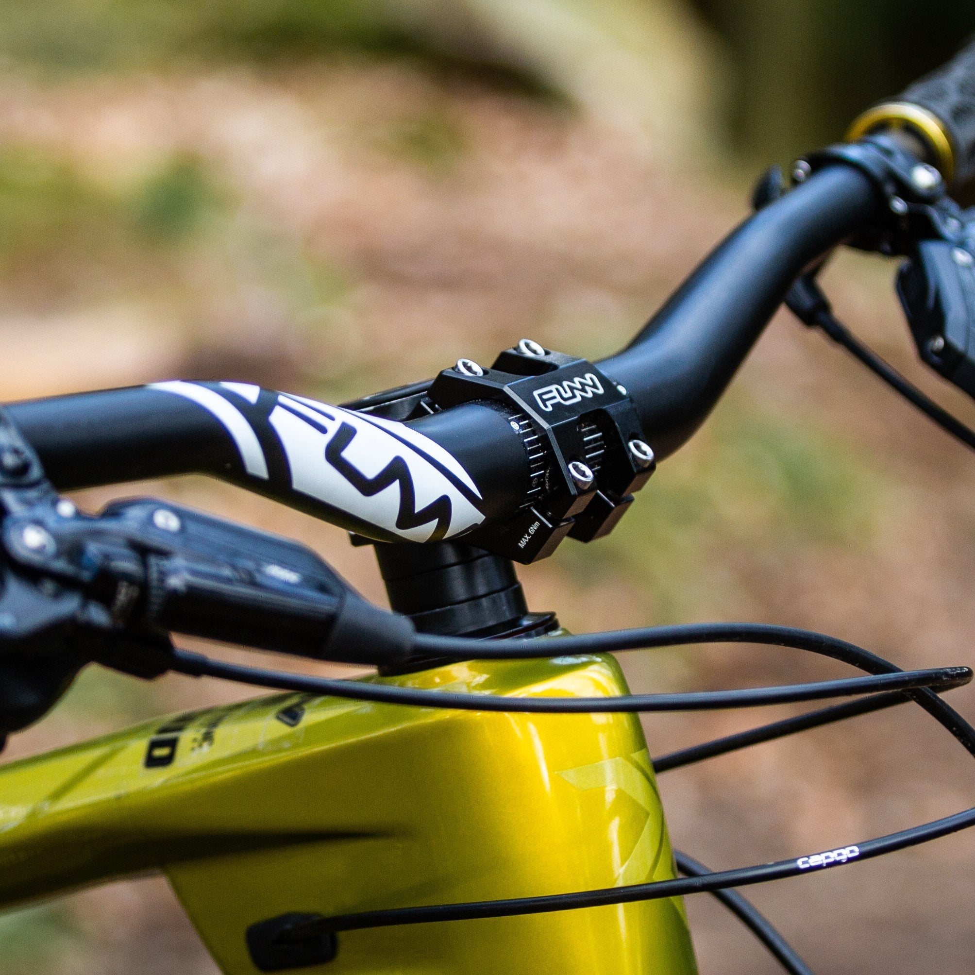 FUNN Funnduro Stem 31.8mm black 35mm, short alloy MTB handlebar stem mounted on yellow trail bike for precise control