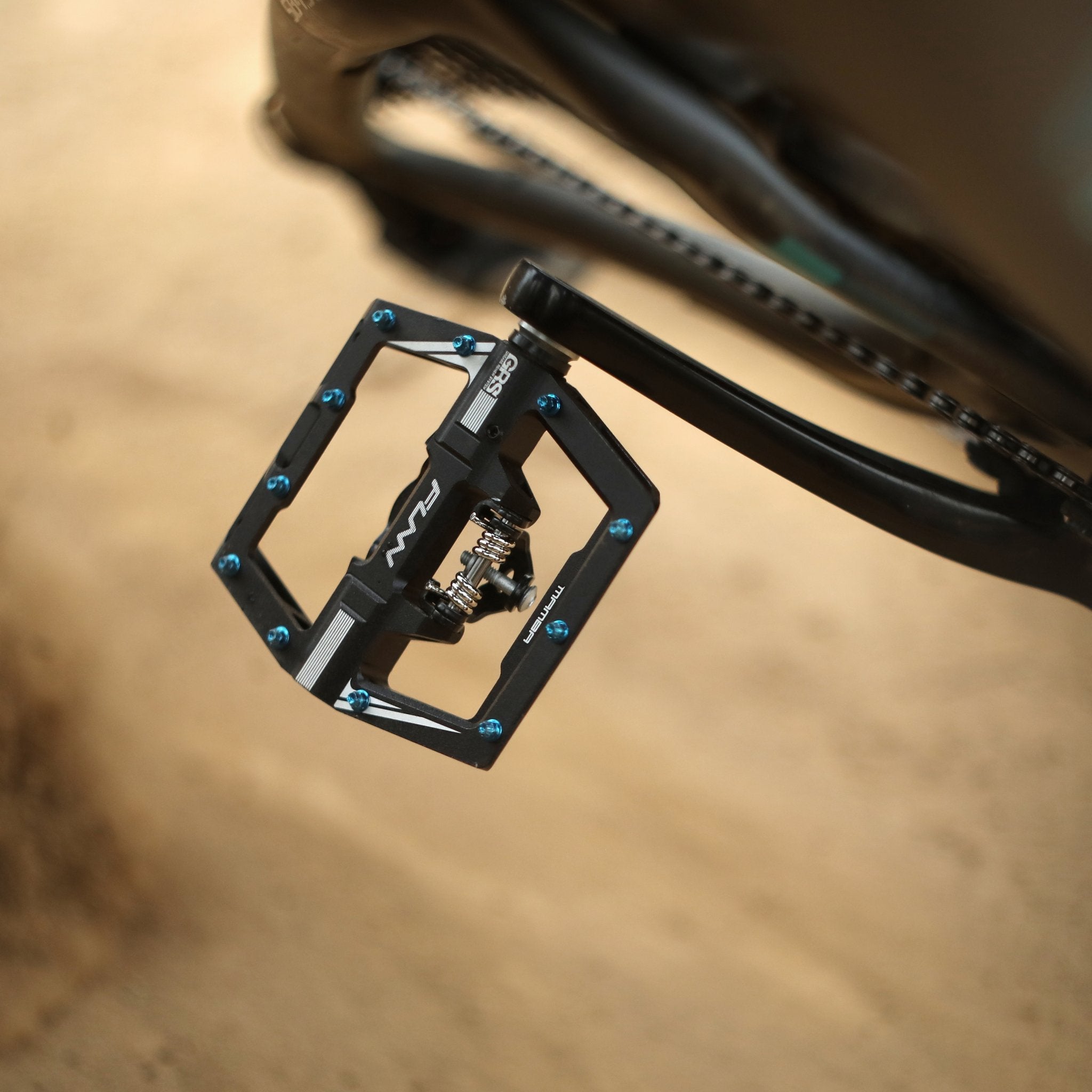FUNN Mamba Clip-In Pedals, black alloy Clip single side design with blue pins mounted on mountain bike crank on trail