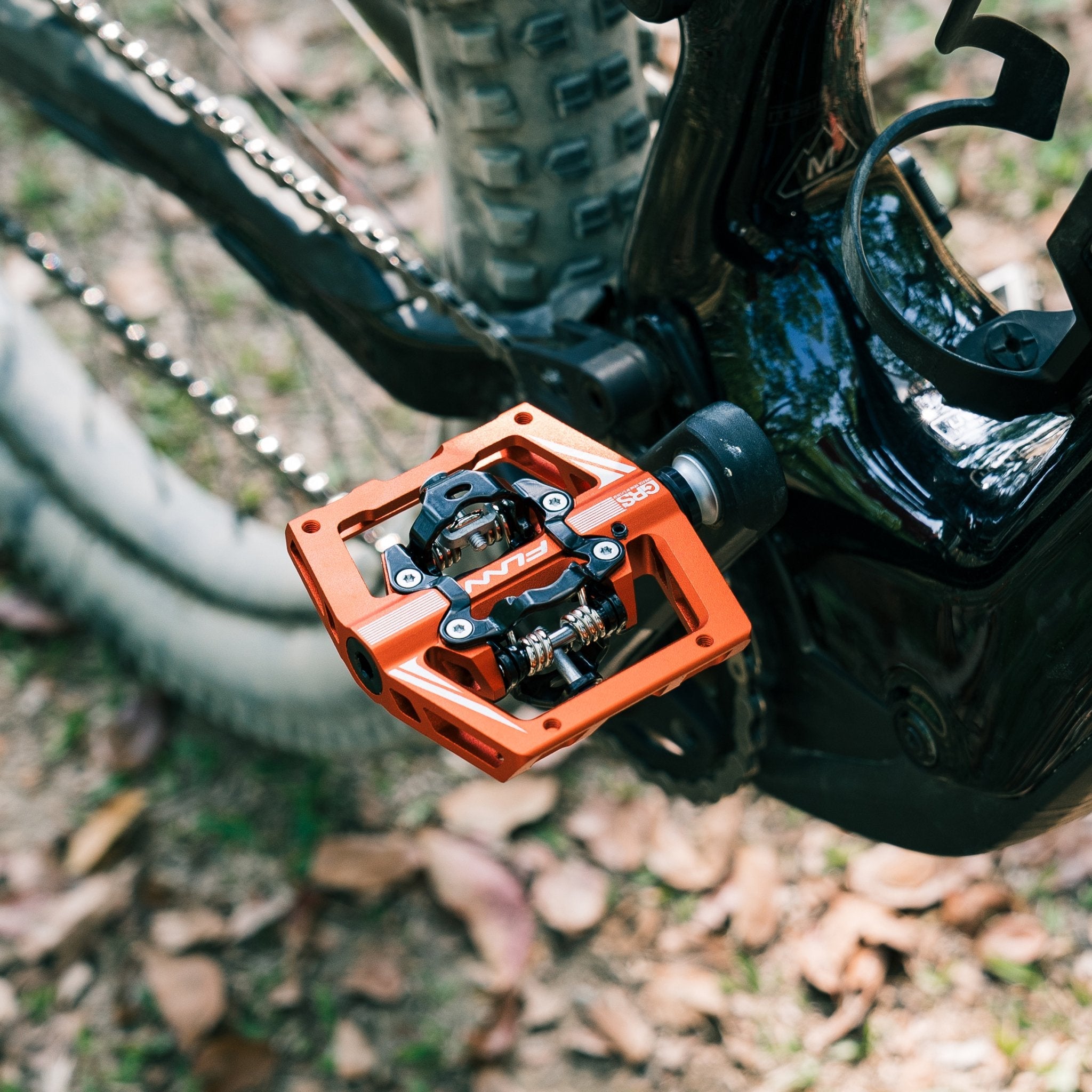 Orange FUNN Mamba S Clip-In Pedals with GRS system on mountain bike, wide alloy platform and dual-sided clip mechanism