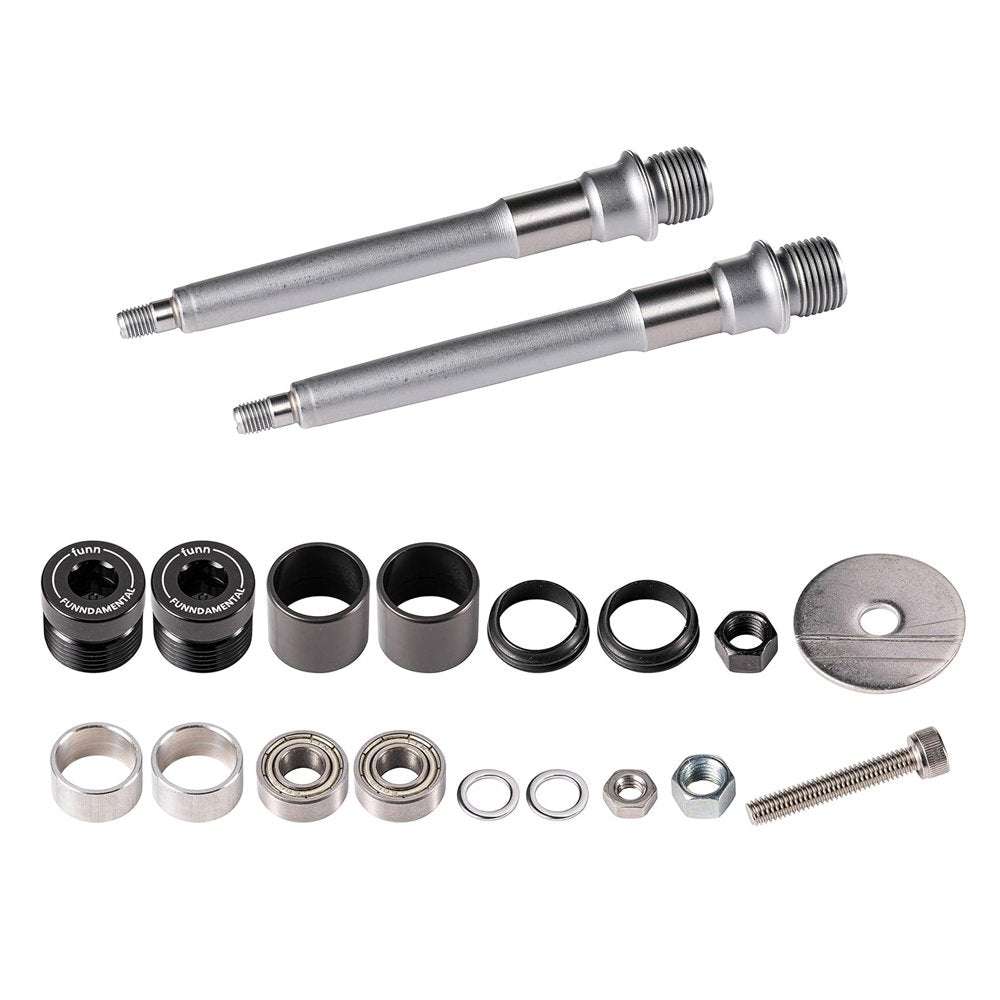 FUNN Funndamental Flat Pedals silver axle and bearing rebuild kit with metal spindles, bushings, seals and hardware laid out