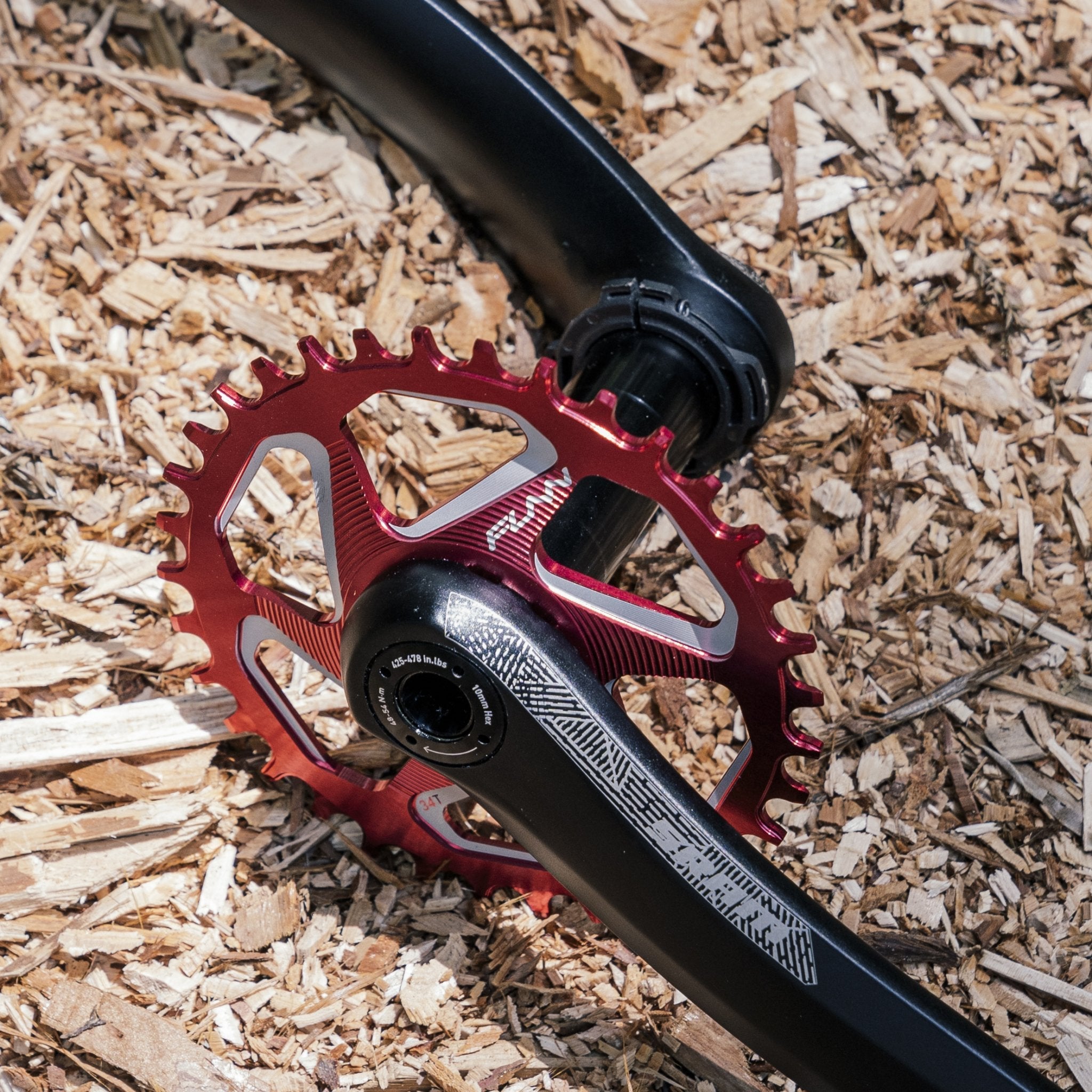 Red FUNN Solo DX Narrow-Wide Chainring with SRAM direct mount interface on black crank arm, machined alloy MTB drivetrain component