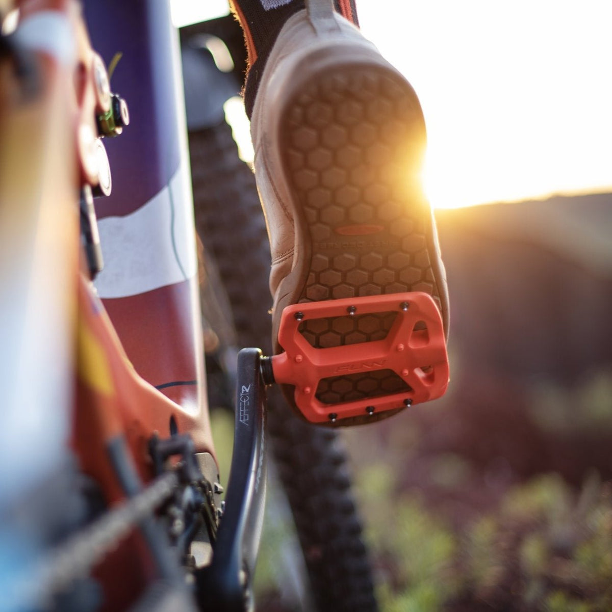 FUNN Taipan Flat Pedals, red composite pedals on a mountain bike, wide platform and metal pins for grippy trail riding