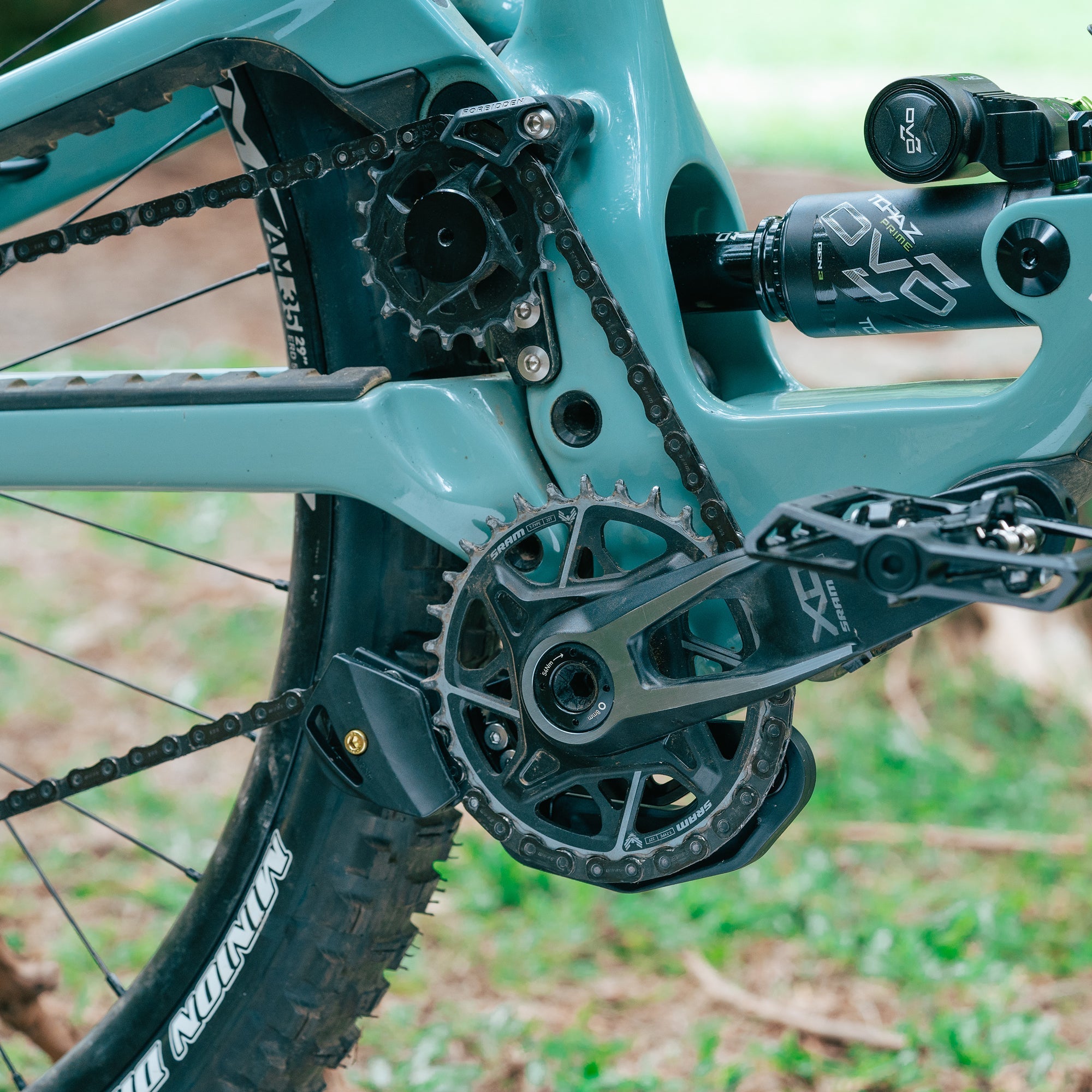 FUNN Zippa LG Chain Guide 28T-32T mounted on teal high pivot bike, black alloy guide protecting chainring and improving stability