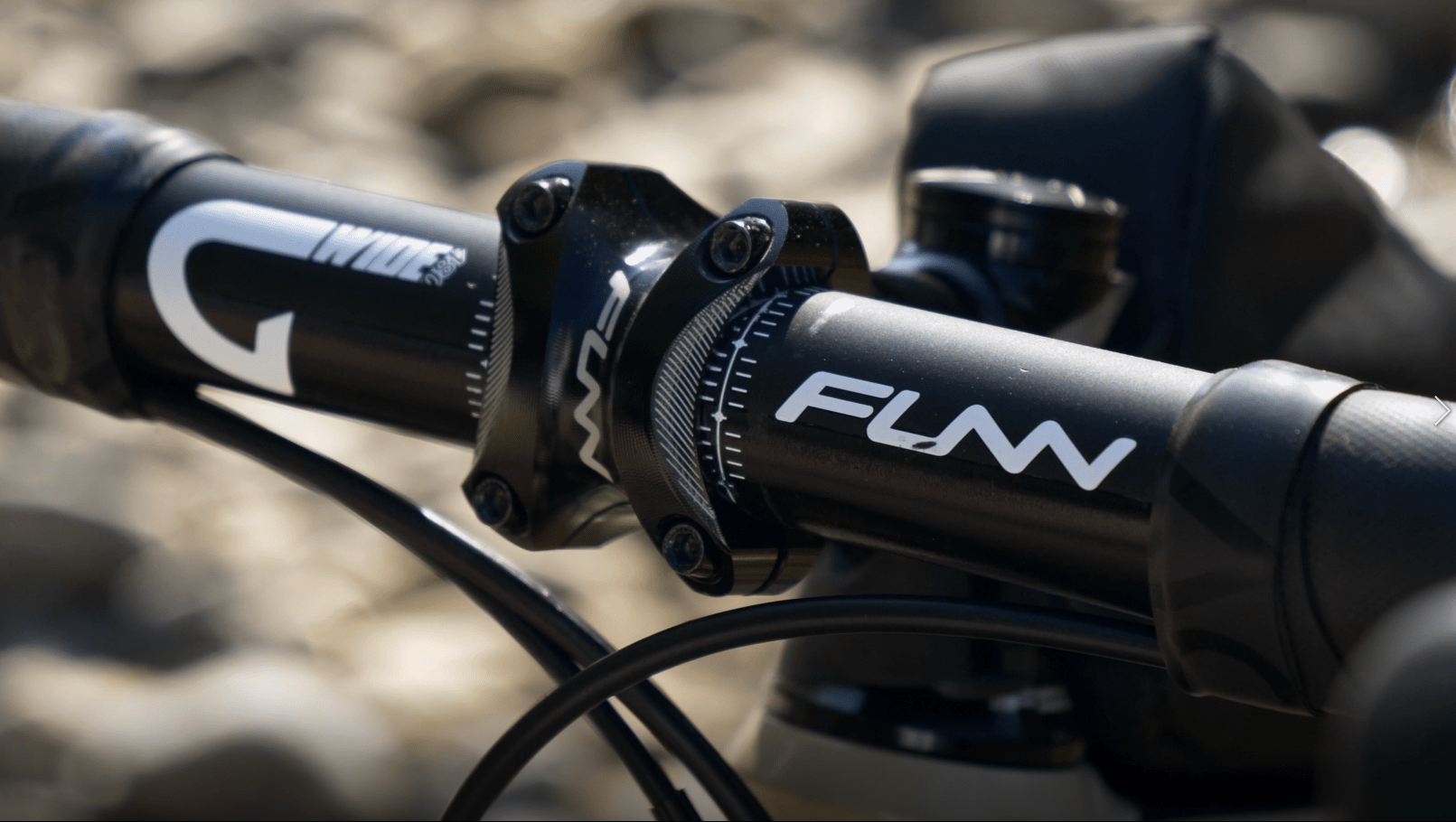 A close up photo for funn g-wide gravel handlebar with tron bike stem