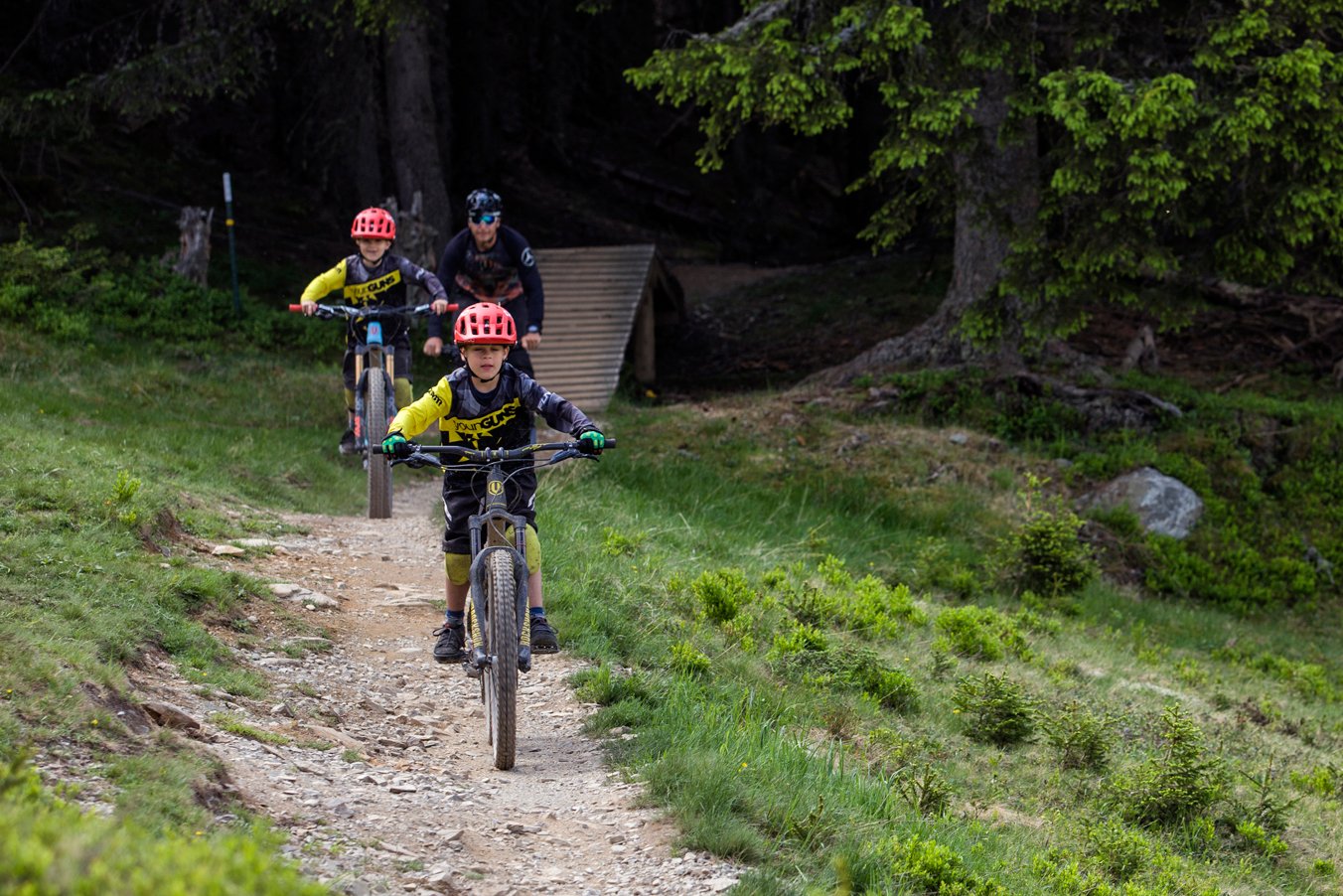 young riders riding on a trail