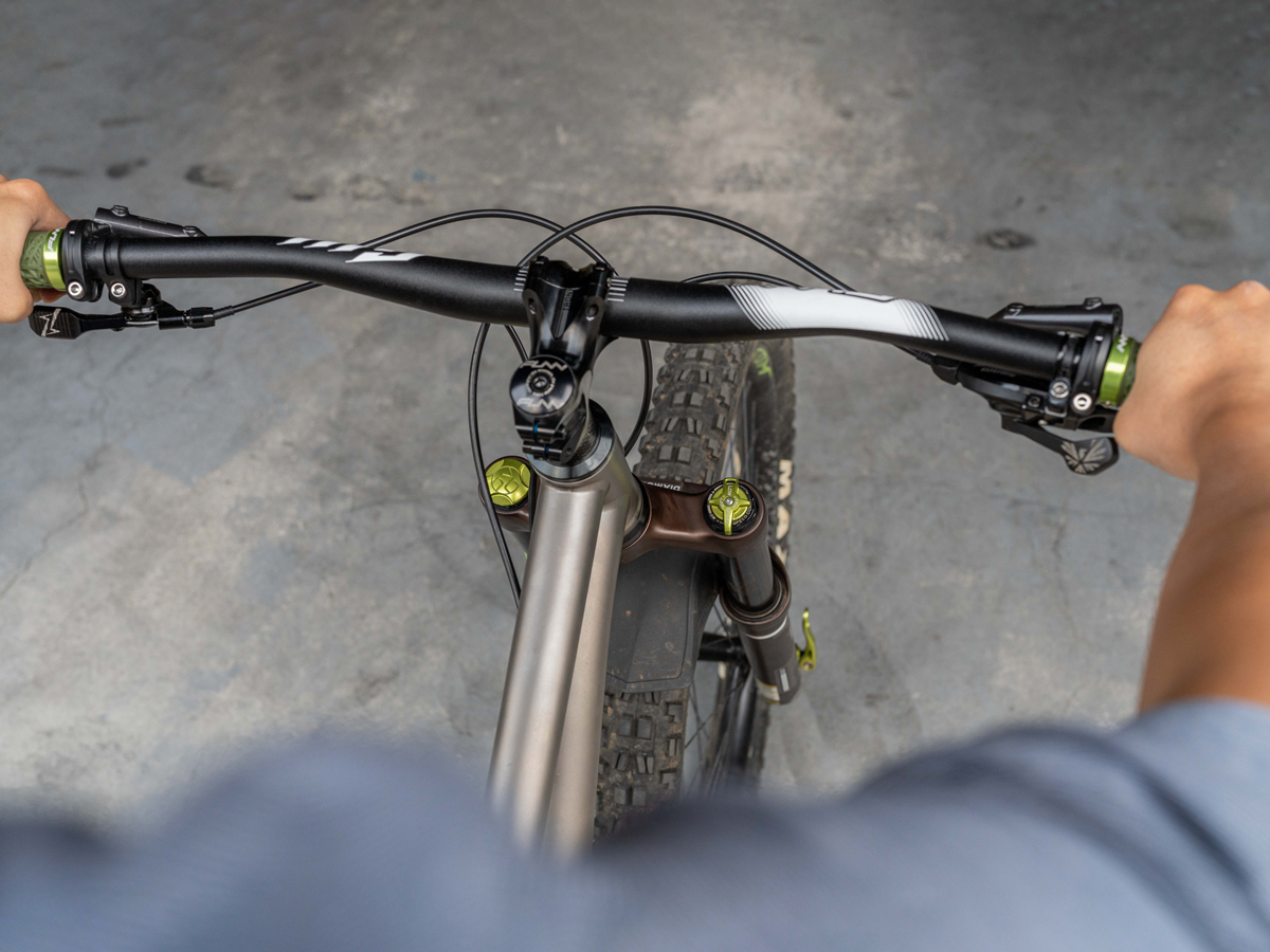 Hold the front brake firmly and gently rock the handlebar forward and back to detect any headset play.