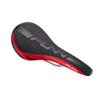 A red and black Adlib bicycle saddle on a white background.