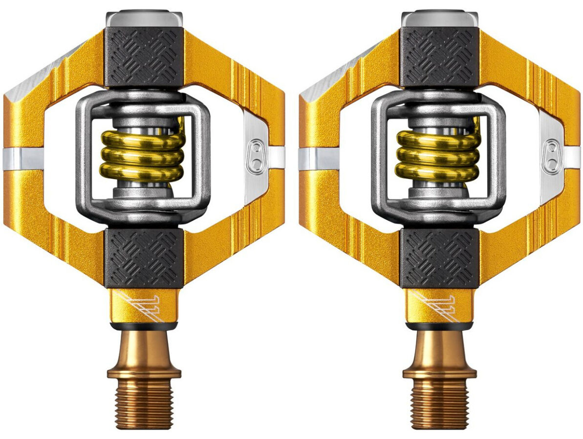 A pair of yellow pedals on a white background.