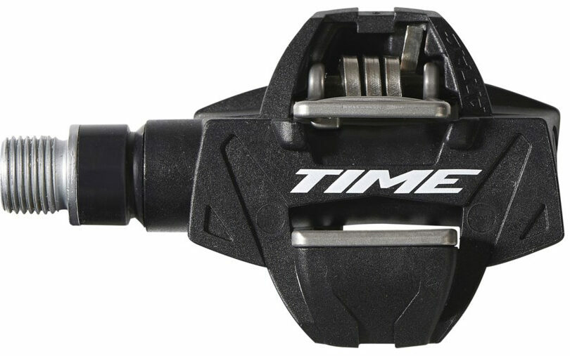 A black bicycle pedal with the word time on it.